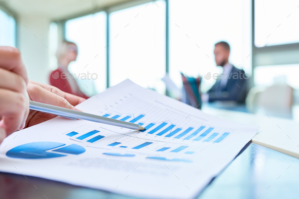 Hand Pointing at Statistics Graph - Stock Photo - Images