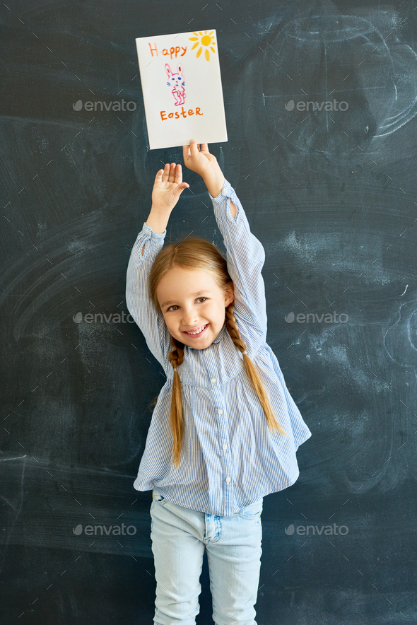 Joyful Little Girl Holding Easter Greeting Card - Stock Photo - Images