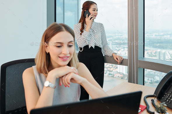 Pesive businesswoman talking on phone - Stock Photo - Images
