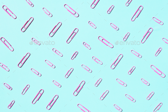 Colored paper clips on pastel blue background. Top view, flat lay. Back to school concept. College - Stock Photo - Images