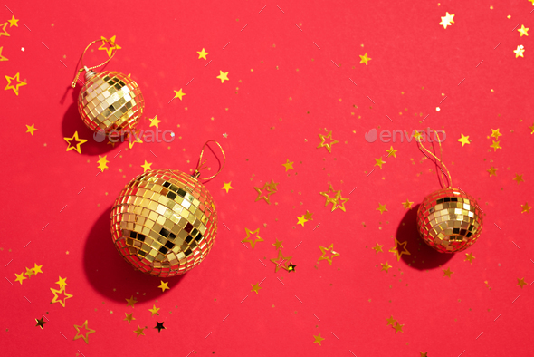 Premium Photo  New year baubles shiny gold disco balls on blue background  pop disco style attributes retro concept creative christmas pattern flat  lay top view