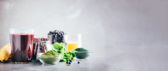 Heavy metals detox smoothie. Blueberries, bilberry, barley grass juice extract, spirulina powder - Stock Photo - Images