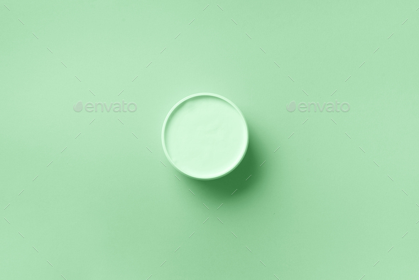 Body butter jar on in trendy mint color background with copy space. Skin care product, natural - Stock Photo - Images