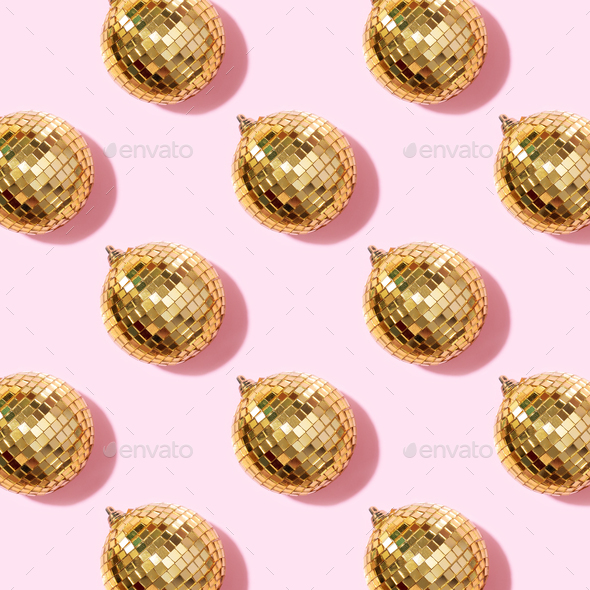 New year baubles. Shiny gold disco balls on pink background. Pop disco  style attributes, retro Stock Photo by jchizhe