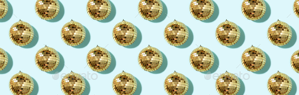Christmas gold baubles organized on blue background. Top view. Flat lay. Creative New year pattern - Stock Photo - Images