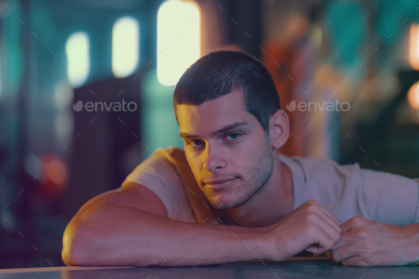 Close-up portrait of attractive male model. Young handsome man in a bar