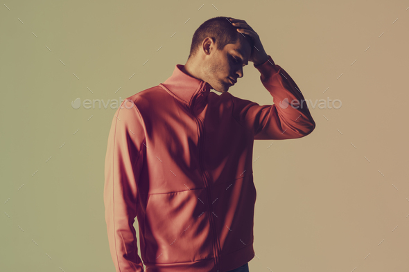 Studio close-up portrait of attractive male model. Color flash studio light - Stock Photo - Images