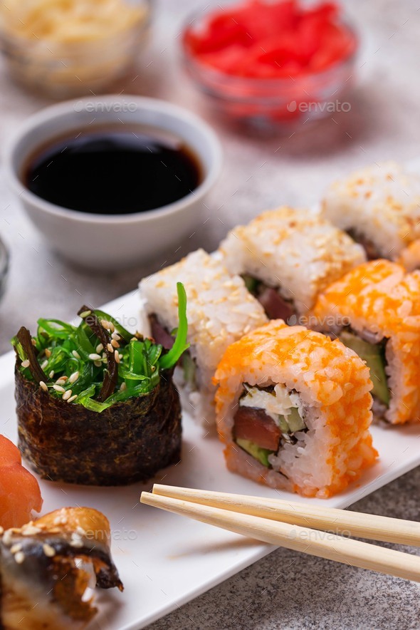 Sushi roll set with wasabi, ginger and soy sauce . Stock Photo by