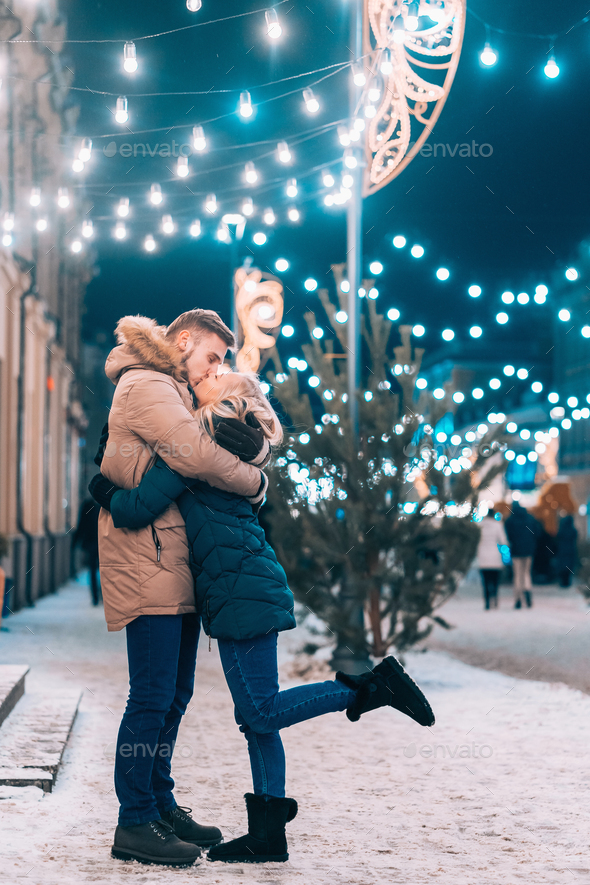 Outdoor close up portrait of young beautiful couple posing on street - Stock Photo - Images