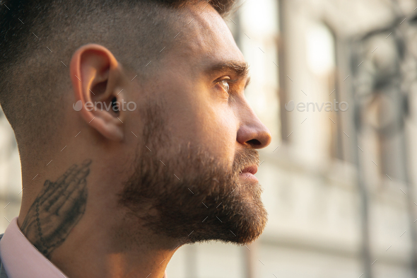 Caucasian romantic young groom celebrating his marriage in city - Stock Photo - Images