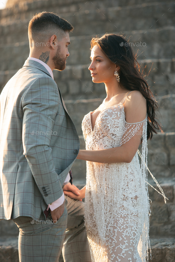 Caucasian romantic young couple celebrating their marriage in city - Stock Photo - Images