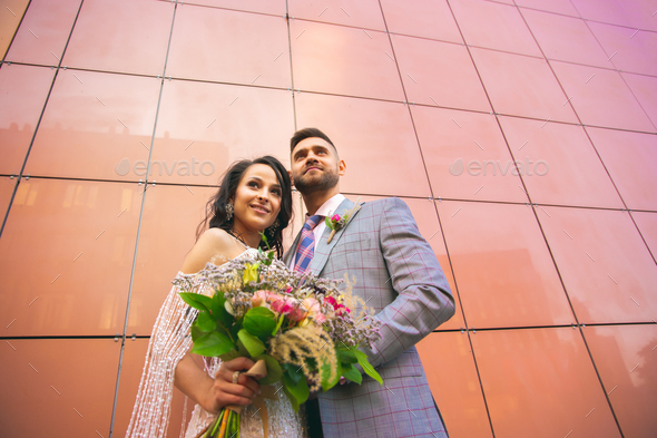 Caucasian romantic young couple celebrating their marriage in city - Stock Photo - Images