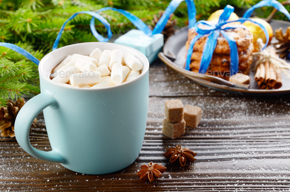 Christmas background of blue hot chocolate mug with marshmallows - Stock Photo - Images