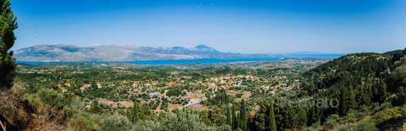 Ultra wide panormaic view of idyllic valley town with red roofs on mediterranean island. Olive - Stock Photo - Images