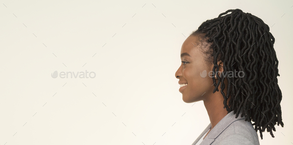 Studio Portrait Of Smiling African American Businesswoman, Side View, Panorama - Stock Photo - Images