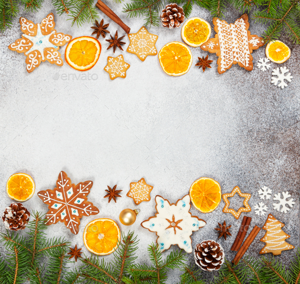 Christmas ginger cookies in the shape snowflakes, dried orange, star anise and fir cones - Stock Photo - Images