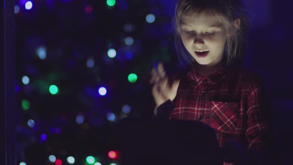 Child Opens a Glowing Gift