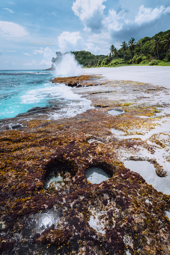 Breathtaking paradise beach Anse Bazarca. White sand, turquoise water, rough swell. Waves splashing - Stock Photo - Images