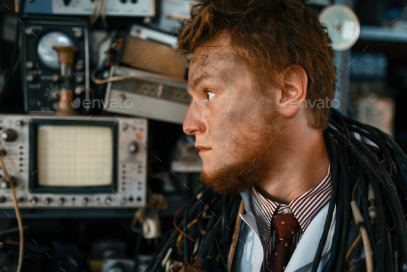 Engineer looks on oscilloscope display in lab - Stock Photo - Images