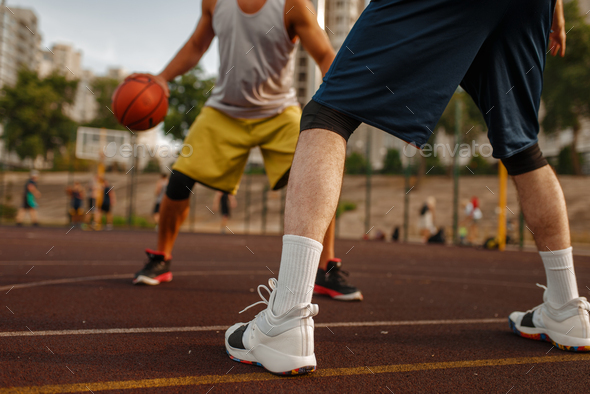 Two players in the center of basketball field - Stock Photo - Images