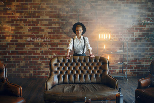 Woman in strict clothes and hat, gangster style - Stock Photo - Images