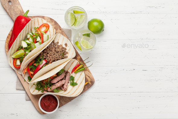 Mexican tacos and caipirinha cocktail - Stock Photo - Images