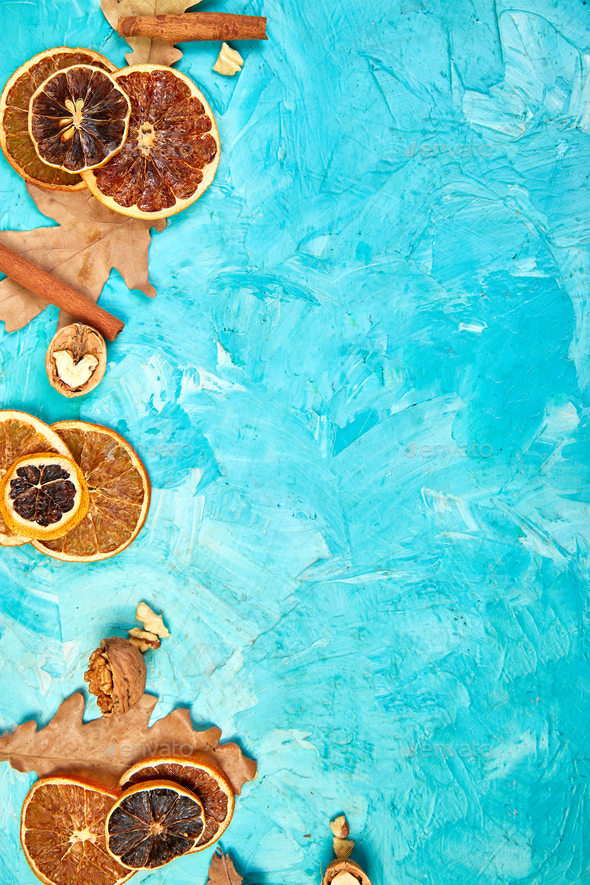 Autumn composition background with slices of dried oranges, leaves and cinnamon. - Stock Photo - Images
