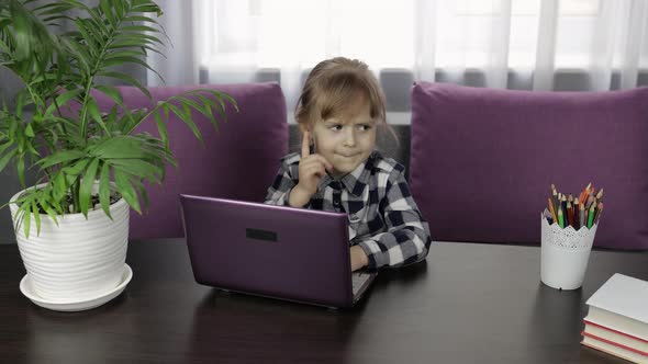 Girl Doing Online Homework Using Digital Laptop Computer. Distance Education alt