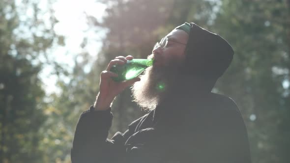 The Bearded Man Drinks Mineral Water alt
