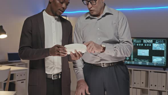 Engineers Discussing D Printed Car Model and Posing alt