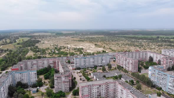 Aerial Panorama on City with Multi-Story Buildings Near Nature and River alt