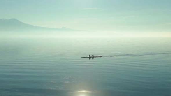 Two Men Kayaking on Sunny Day on Lake Geneva. Swiss Alps, Switzerland alt