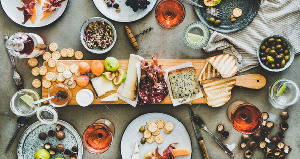 Seasonal picnic with rose wine, cheese, charcuterie, nuts and fruits - Stock Photo - Images