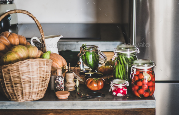 Fresh ingredients and glass jars with homemade vegetables preserves, close-up - Stock Photo - Images
