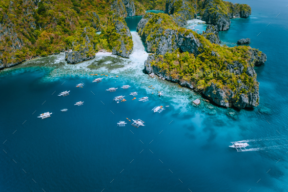 Aerial view of amazing Mililoc Island. Tourist boats near big Lagoon. El Nido, Palawan, Philippines - Stock Photo - Images