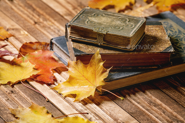 Books and autumn leaves