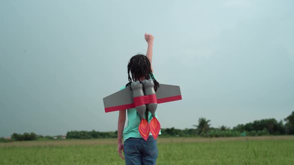 Kid flying to the sky with a rocket jetpack like a superhero pilot