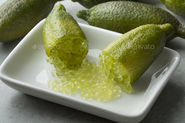 Halved fresh raw green finger lime caviar with sour pearls