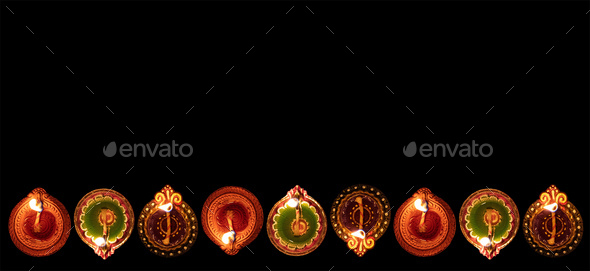 Diwali, Hindu festival of lights celebration. Diya oil lamps against dark background, - Stock Photo - Images