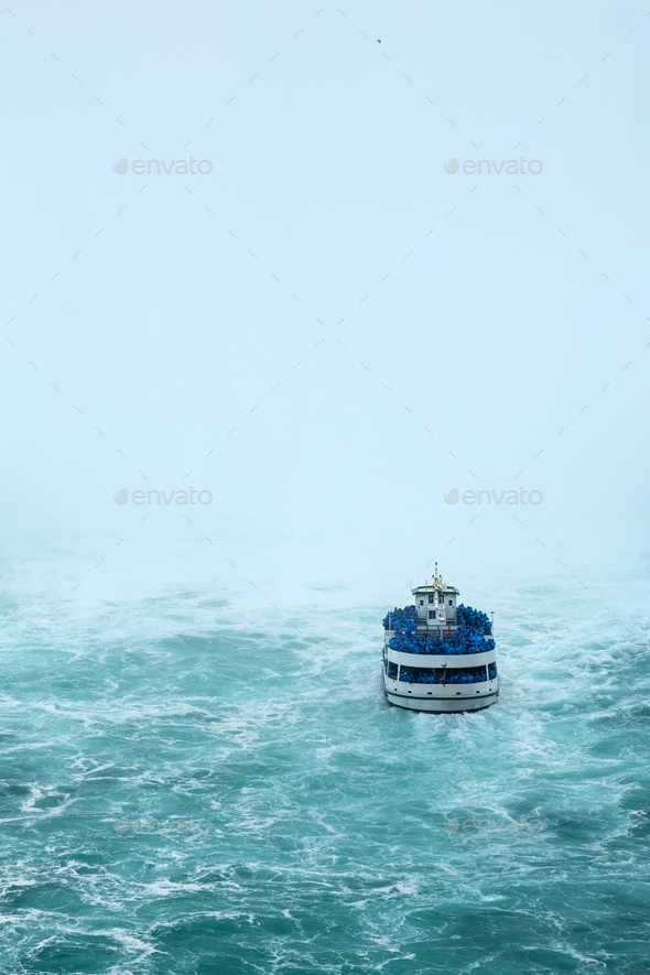Ferry approaching the famous Niagara Fall - Stock Photo - Images