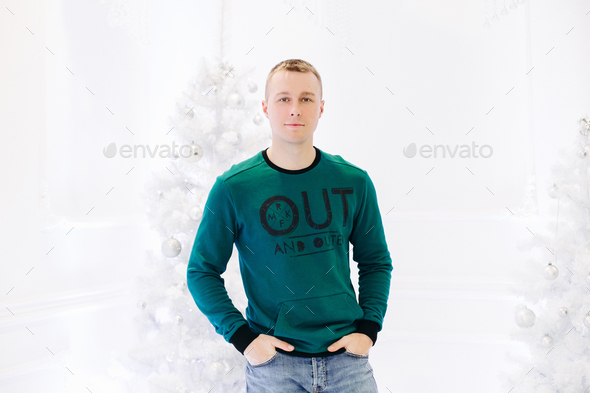 Handsome man posing in studio with white background - Stock Photo - Images