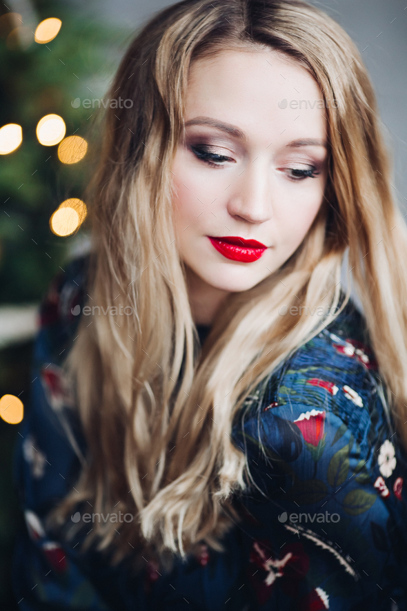 Portrait of beautiful woman having make up and red lips - Stock Photo - Images
