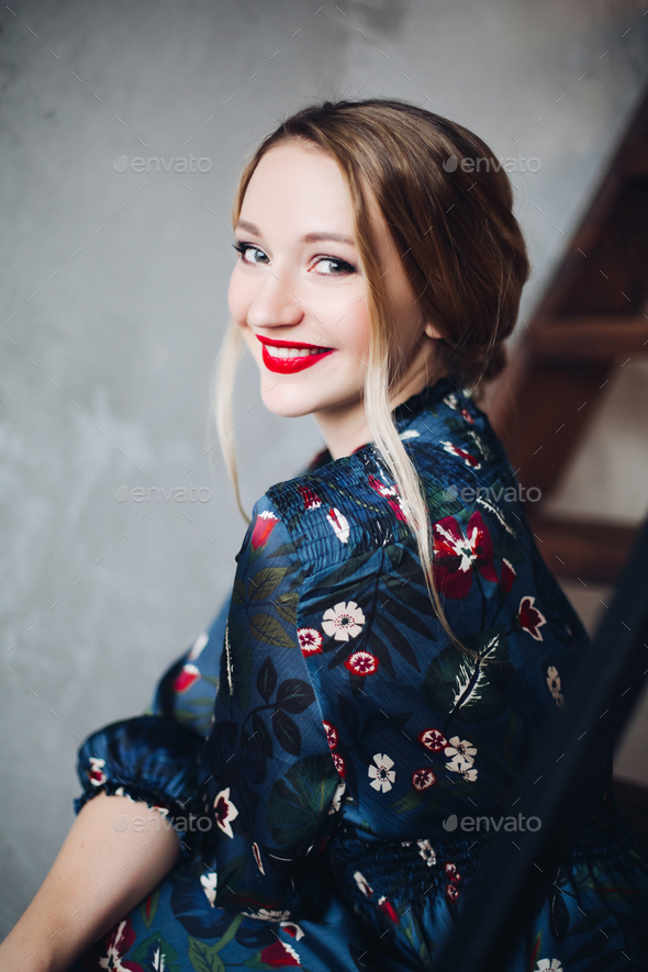 Portrait of beautiful woman having make up and red lips - Stock Photo - Images