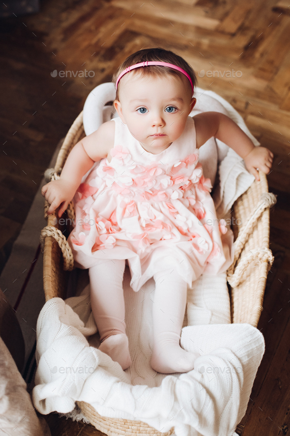 View from above of sweet little cute girl in cute pink dress - Stock Photo - Images