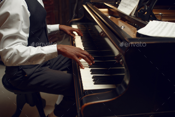 Ebony pianist, jazz performer on the stage - Stock Photo - Images