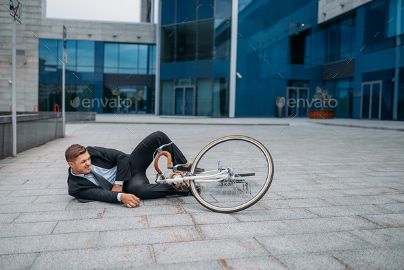 Businessman fell off his bike at office building