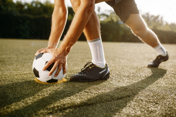 Male soccer player prepares to hits the ball - Stock Photo - Images
