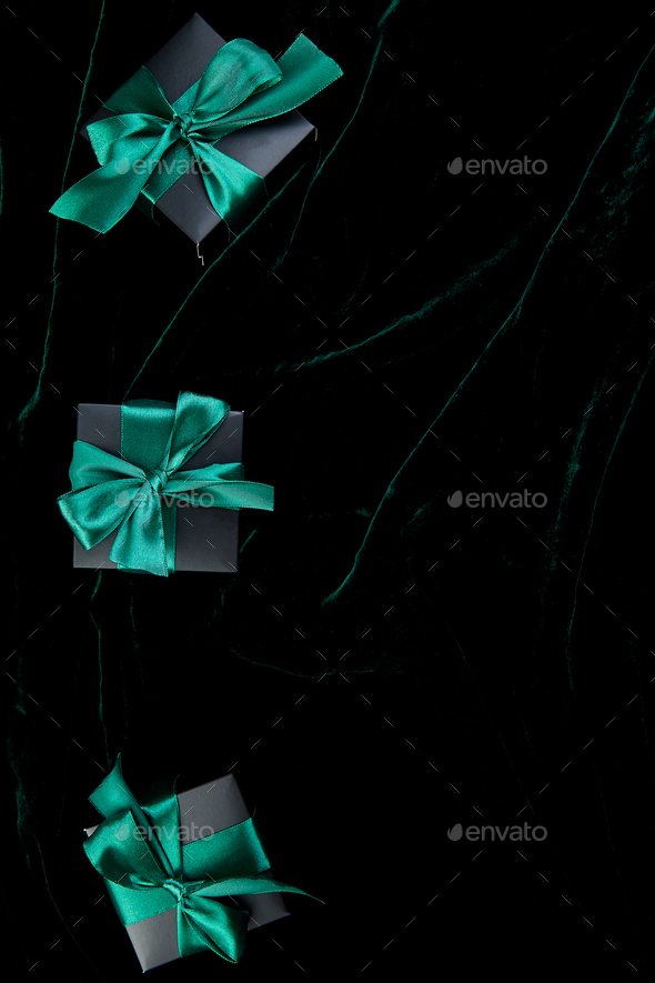 Luxury black gift boxes with green ribbon - Stock Photo - Images