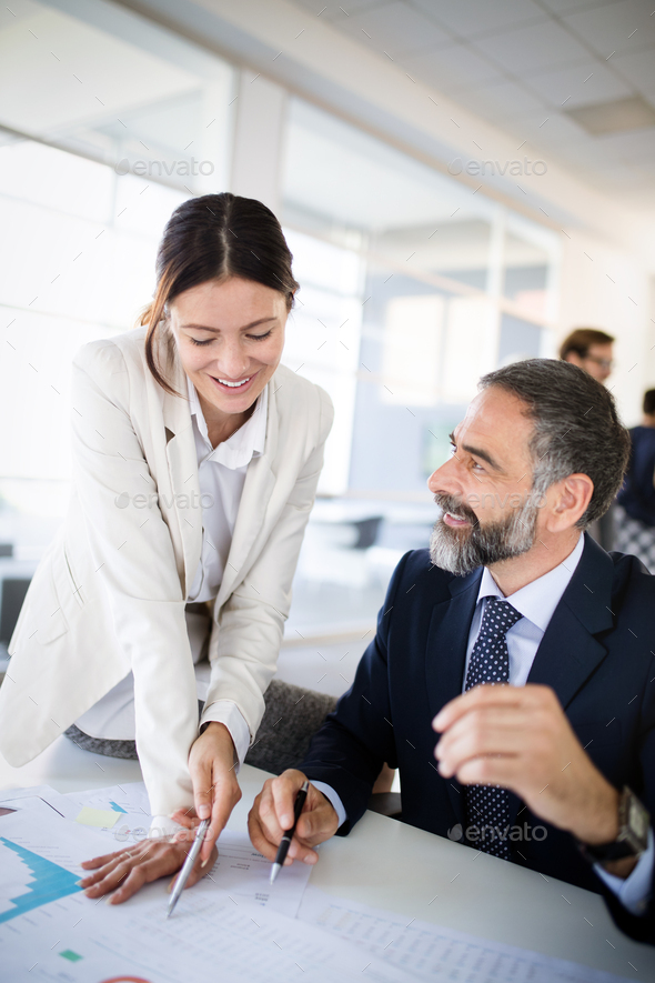 Successful team leader and business owner leading informal in-house business meeting - Stock Photo - Images