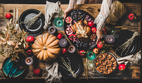 Thanksgiving party table setting with roasted chicken and fig pie - Stock Photo - Images